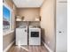 Convenient laundry room with washer, dryer, and storage at 3880 Sheridan Blvd, Denver, CO 80212