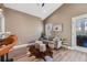 Cozy living room with a comfy couch and large windows at 3880 Sheridan Blvd, Denver, CO 80212