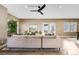 Spacious living room with large windows and access to deck at 3880 Sheridan Blvd, Denver, CO 80212