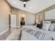 Bright main bedroom with ensuite bathroom access and ceiling fan at 3880 Sheridan Blvd, Denver, CO 80212