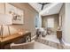 Bright home office featuring built-in shelving and hardwood floors at 3880 Sheridan Blvd, Denver, CO 80212