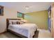 Cozy bedroom with hardwood floors, soft lighting, and windows at 4545 King St, Denver, CO 80211