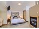 Cozy bedroom features soft carpet, a window, and fireplace at 4545 King St, Denver, CO 80211