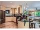 Modern kitchen with stainless steel appliances, granite countertops, and a view into the cozy living area at 4545 King St, Denver, CO 80211