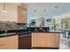 Bright kitchen with granite countertops, stainless steel appliances, and view into the dining area at 4545 King St, Denver, CO 80211