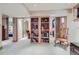 Open living room area with a bookcase and decorative chair at 4545 King St, Denver, CO 80211