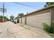 Detached garage with multiple bays and alley access in a residential neighborhood at 2077 S Clayton St, Denver, CO 80210
