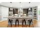 Elegant kitchen featuring granite countertops, a large island, stainless steel appliances, and ample cabinet space at 2077 S Clayton St, Denver, CO 80210
