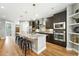 Spacious kitchen with a large island, stainless steel appliances, and a breakfast bar with seating at 2077 S Clayton St, Denver, CO 80210
