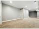 Living room featuring neutral walls, carpet, recessed lighting, and a staircase to the next level at 2077 S Clayton St, Denver, CO 80210