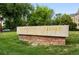 University of Denver stone sign on a lush green lawn at 2077 S Clayton St, Denver, CO 80210