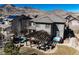 Aerial view of a backyard featuring a patio, pergola, hot tub, and beautiful mountain views at 15798 Weaver Gulch Dr, Morrison, CO 80465