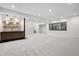 Finished basement with a wet bar, recessed lighting, and ample living space at 2960 E Floyd Dr, Denver, CO 80210
