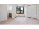 Bedroom featuring hardwood floors, a large window, and ample closet space at 2960 E Floyd Dr, Denver, CO 80210