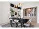 Elegant dining area with modern decor, built-in storage, and open-concept design at 2960 E Floyd Dr, Denver, CO 80210
