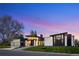 Stylish home featuring stone accents, flat roofline, modern design and professional landscaping at 2960 E Floyd Dr, Denver, CO 80210