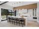 Spacious kitchen with a large island, seating, and modern finishes plus exterior view at 2960 E Floyd Dr, Denver, CO 80210