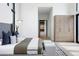 Bright main bedroom with natural wood accents, patterned carpet, and contemporary furnishings at 2960 E Floyd Dr, Denver, CO 80210