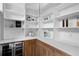 Well-organized pantry with ample shelving, countertops, and a beverage refrigerator at 2960 E Floyd Dr, Denver, CO 80210