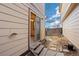 Cozy backyard featuring a stone pathway leading to a sliding glass door at 1816 S Pagosa Way # 5, Aurora, CO 80017