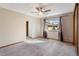Bedroom with a ceiling fan, neutral carpet, and a window view at 1816 S Pagosa Way # 5, Aurora, CO 80017