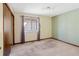 Bedroom featuring neutral carpet and walls with a single window at 1816 S Pagosa Way # 5, Aurora, CO 80017