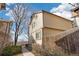 View of the exterior of the beige two-story home with trees in the yard at 1816 S Pagosa Way # 5, Aurora, CO 80017