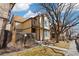 View of a charming two-story townhome with neutral siding, brown trim, and a small front yard with walkway at 1816 S Pagosa Way # 5, Aurora, CO 80017