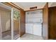 Convenient laundry room with washer, dryer, storage shelves, and access to the outdoors at 1816 S Pagosa Way # 5, Aurora, CO 80017