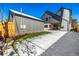 Backyard with a modern home design, a covered patio, and fresh green grass at 1685 S Milwaukee St, Denver, CO 80210