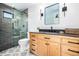 Stylish bathroom with modern fixtures, patterned floors, and a glass shower at 1685 S Milwaukee St, Denver, CO 80210