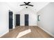 Bright bedroom featuring hardwood floors, white walls, and black window trim at 1685 S Milwaukee St, Denver, CO 80210