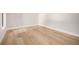 Bright bedroom featuring hardwood floors and white walls at 1685 S Milwaukee St, Denver, CO 80210