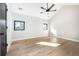 Bright bedroom featuring hardwood floors and two windows at 1685 S Milwaukee St, Denver, CO 80210