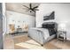 Spacious main bedroom features a large bed, seating area, and modern decor at 1685 S Milwaukee St, Denver, CO 80210