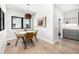 Cozy dining area with wood floors, modern light fixture, and seating for four at 1685 S Milwaukee St, Denver, CO 80210