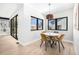 Bright dining area with modern lighting, large windows, and seating for four at 1685 S Milwaukee St, Denver, CO 80210