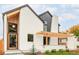 Modern home exterior with white brick, wood accents, and a covered entrance at 1685 S Milwaukee St, Denver, CO 80210
