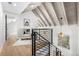 Bright upstairs hallway featuring wood floors, modern railings, and stylish decor at 1685 S Milwaukee St, Denver, CO 80210
