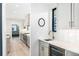 Contemporary kitchen featuring white countertops, a wine fridge, and stainless steel fixtures at 1685 S Milwaukee St, Denver, CO 80210