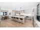 Open kitchen design with a large central island and bar stool seating and an adjacent breakfast nook at 1685 S Milwaukee St, Denver, CO 80210