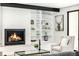 Cozy living room with a fireplace, built-in shelving, and a comfortable armchair at 1685 S Milwaukee St, Denver, CO 80210