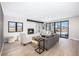 Spacious living room with a fireplace, built-in shelving, and a sliding glass door to the backyard at 1685 S Milwaukee St, Denver, CO 80210