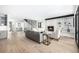 Open-concept living room with modern finishes, a fireplace, and seamless flow to other living spaces at 1685 S Milwaukee St, Denver, CO 80210