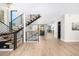 Modern staircase with black metal railings, wooden steps, and an open design leading to the upper level at 1685 S Milwaukee St, Denver, CO 80210