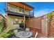 A patio in the backyard provides an outdoor space for relaxing and dining at 3313 Curtis St, Denver, CO 80205