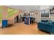 Finished basement with stainless appliances, seating area, and bright kitchenette at 3313 Curtis St, Denver, CO 80205