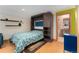 Finished basement includes a murphy bed with storage shelves, ready for guests at 3313 Curtis St, Denver, CO 80205