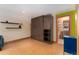 Finished basement boasts a murphy bed, shelves, and an adjacent bathroom at 3313 Curtis St, Denver, CO 80205