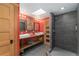 Modern bathroom has double sinks, an oversized walk-in shower, and unique fixtures at 3313 Curtis St, Denver, CO 80205